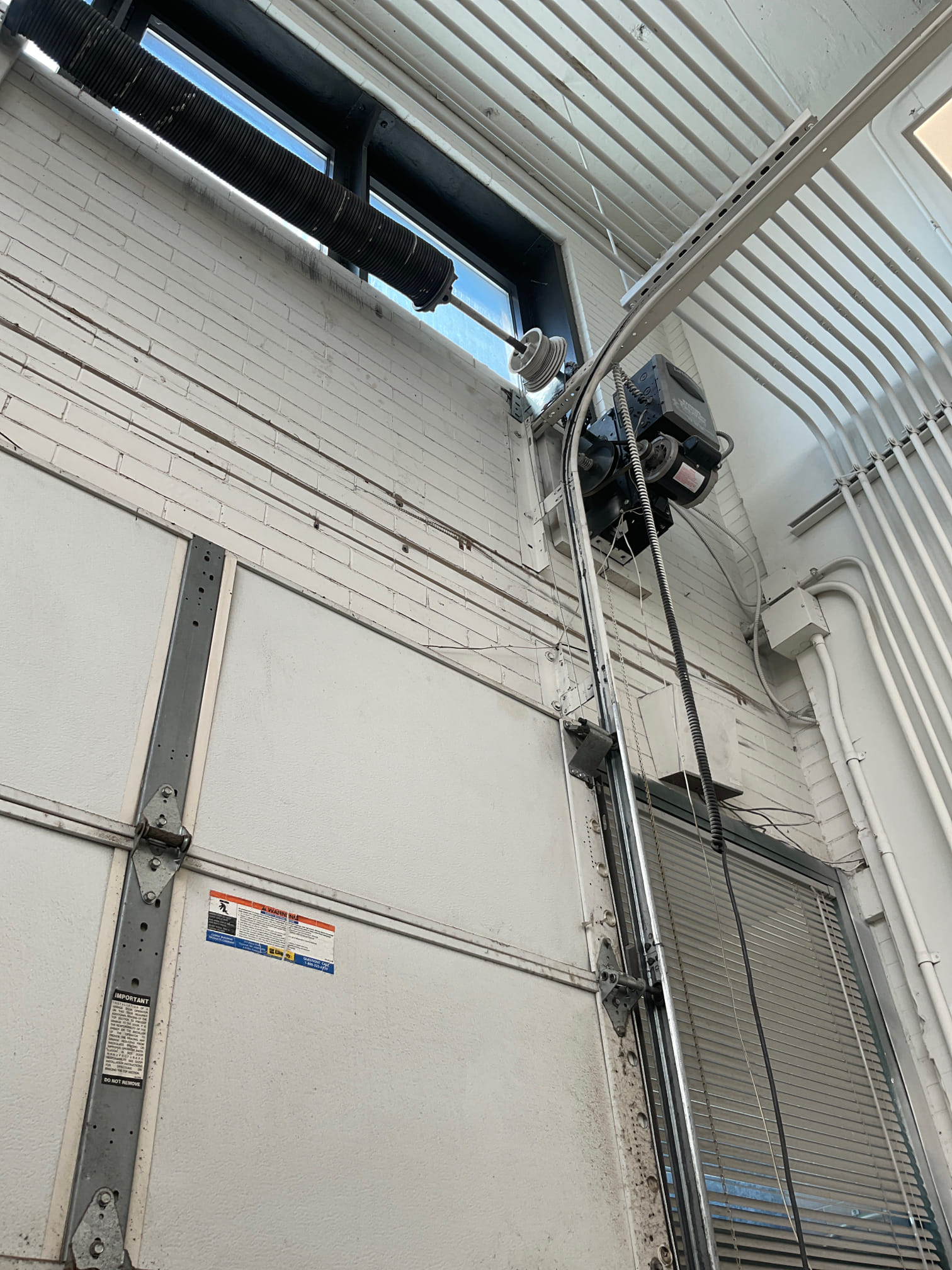 Commercial garage door opener and lifting system serviced by Lift Doctors